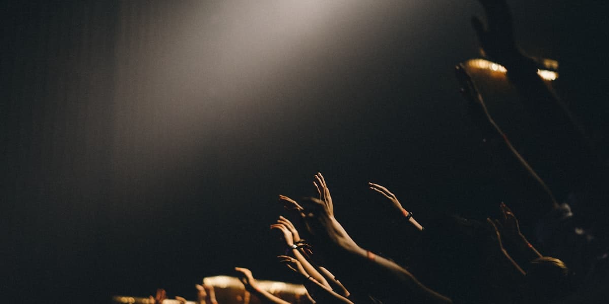 Congregation worshipping with hands raised